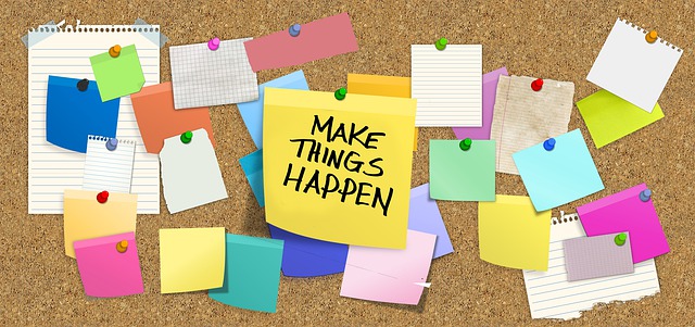 post-its with the focus on one saying "Make Things Happen"