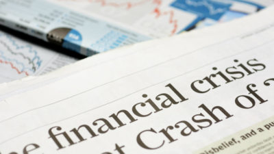 Close up of newspaper headline for financial crisis news