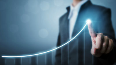 businessman pointing at graph