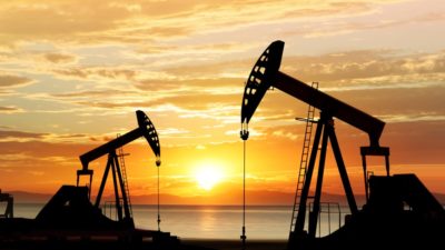 Oil pumps against sunset