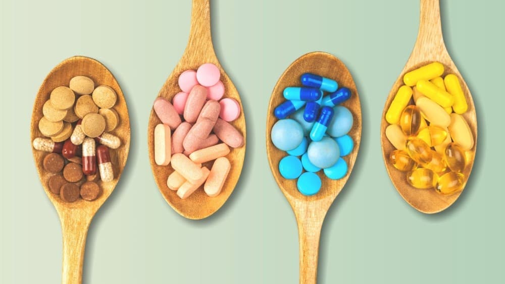 Pills on wooden spoons