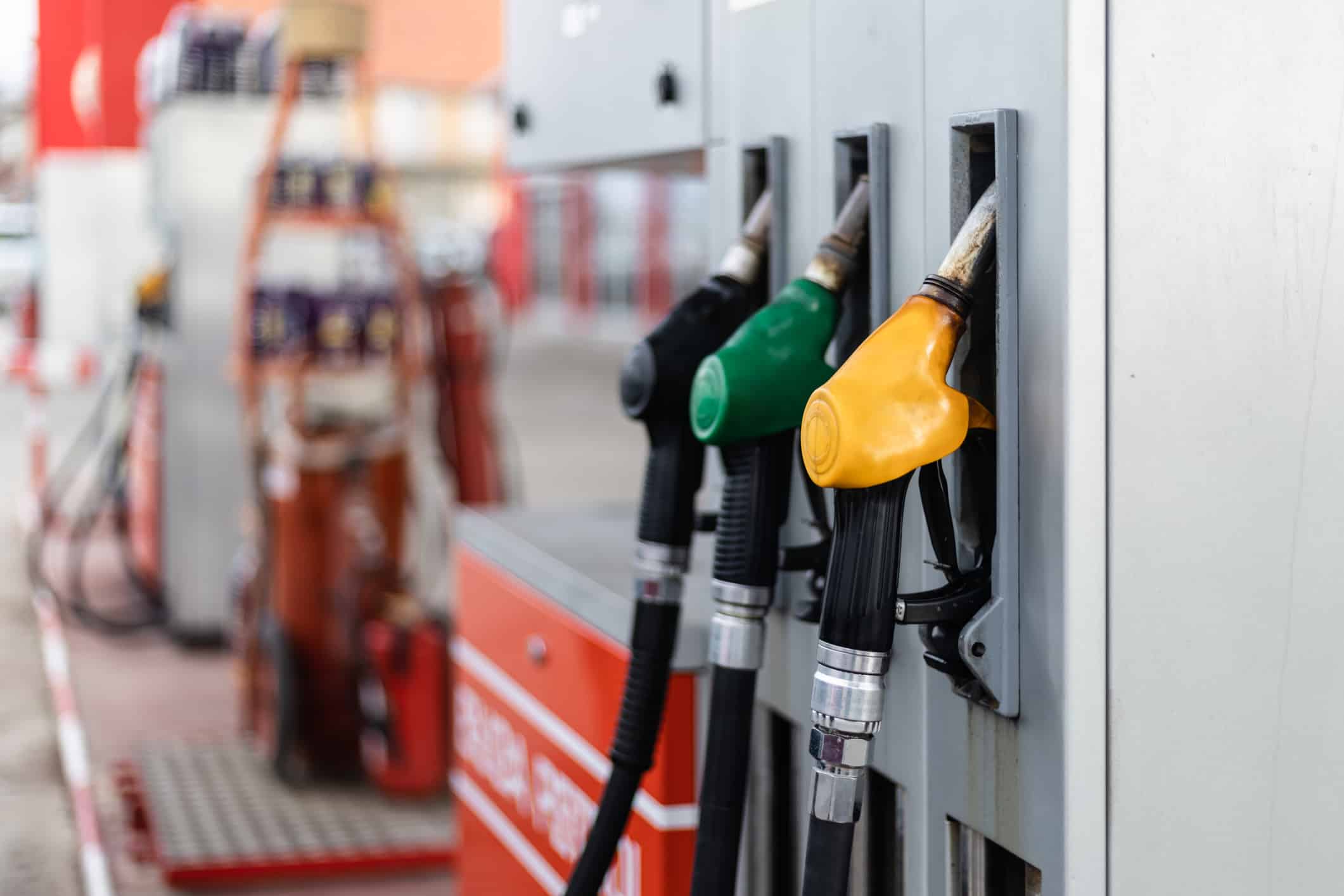 Pumps await a car for fueling at a gas and diesel station.