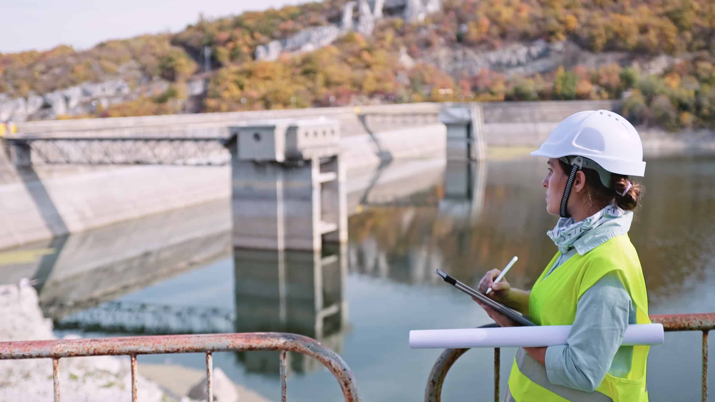An engineer works at a hydroelectric power station, which creates renewable energy.