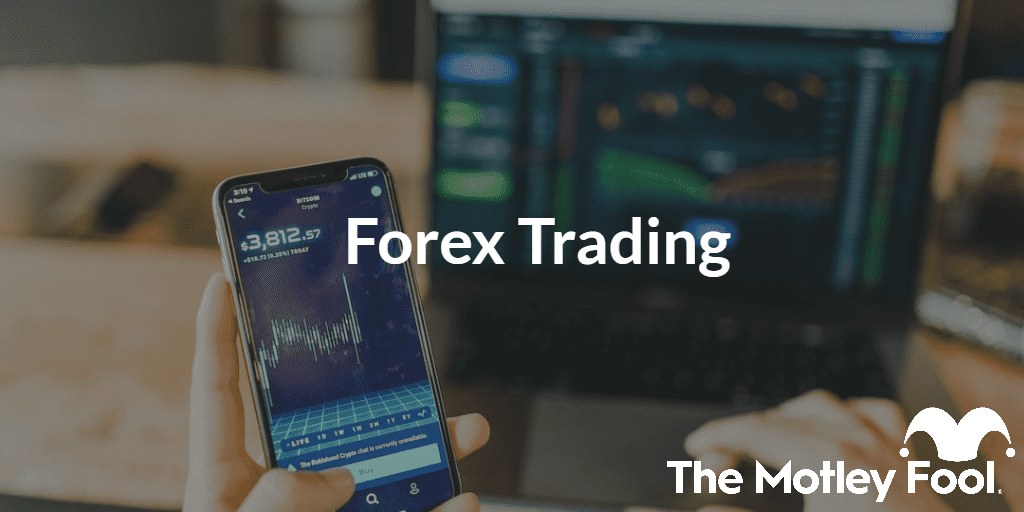 Trader looking at trading charts with the text “Forex Trading” and The Motley Fool jester cap logo