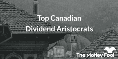 View of rooftop with the text “Top Canadian Dividend Aristocrats” and The Motley Fool jester cap logo
