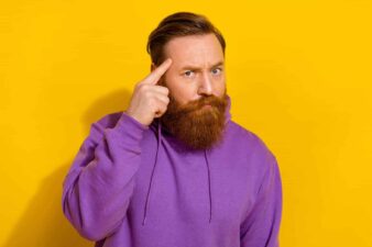 man touches brain to show a good idea