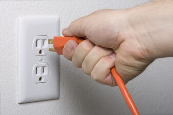 electrical cord plugs into wall socket for more energy