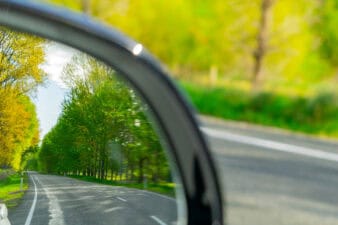 looking backward in car mirror