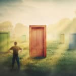 Canadian investor contemplating U.S. stocks with multiple doors to choose from.