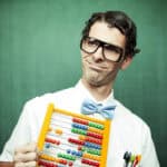 man in bowtie poses with abacus