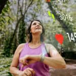 runner checks her biodata on smartwatch