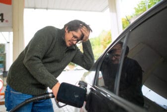 customer fills up car with gasoline