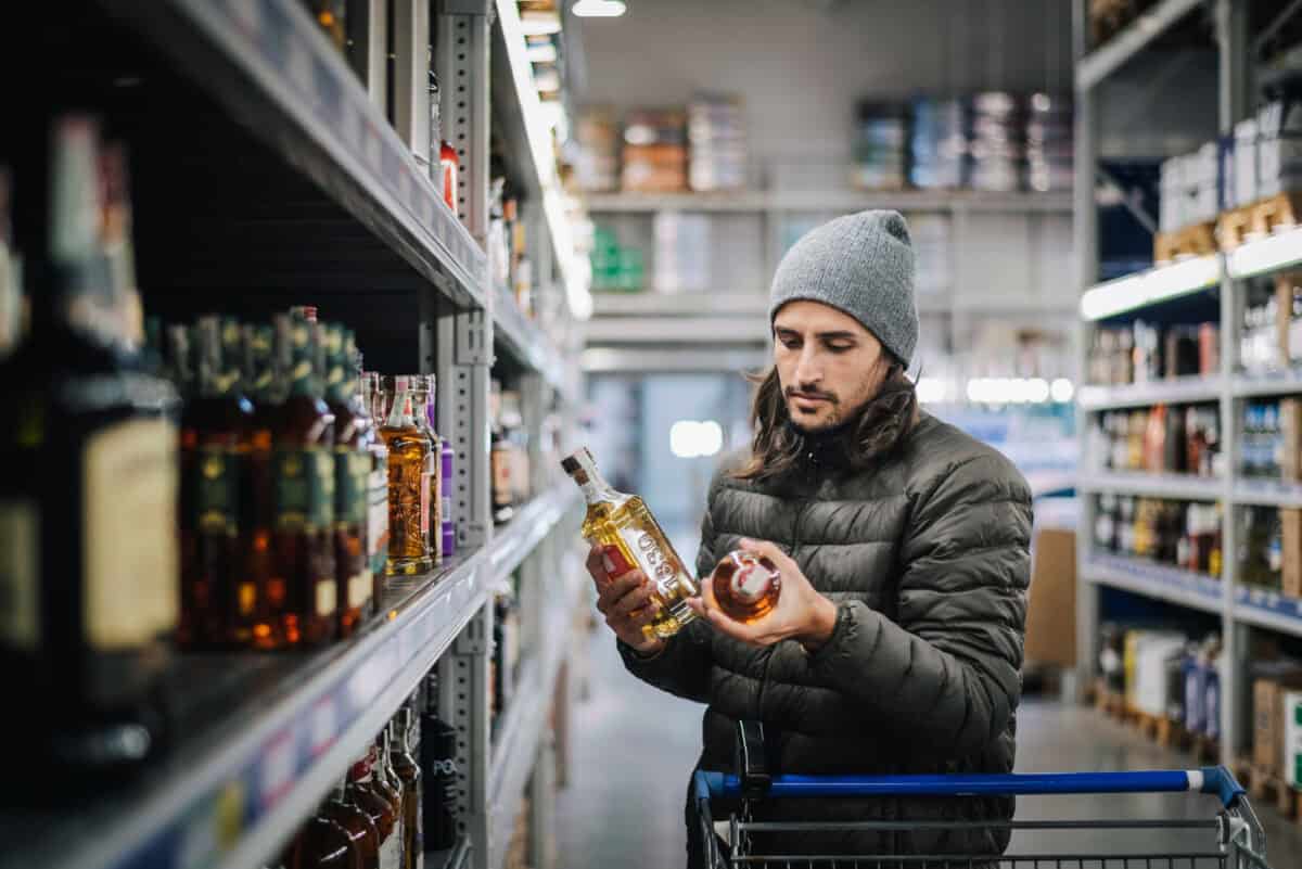 customer comparison shops in liquor store