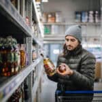 customer comparison shops in liquor store