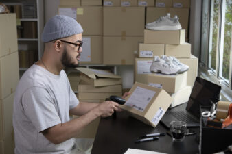 scanning a package shipping label for ecommerce delivery
