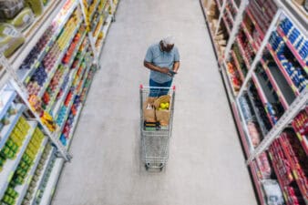man shops at grocery store